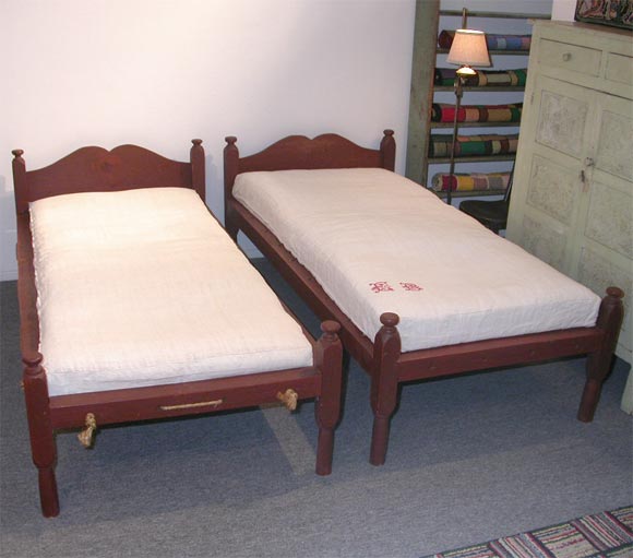 PAIR OF RARE 19THC ORIGINAL PAINTED ROPE BEDS FOUND IN MAINE WONDERFUL RED PAINTED SURFACE / GREAT BUTTERFLY SCALLOPED HEADBOARDS GREAT FOR A CHILDS ROOM!!!!