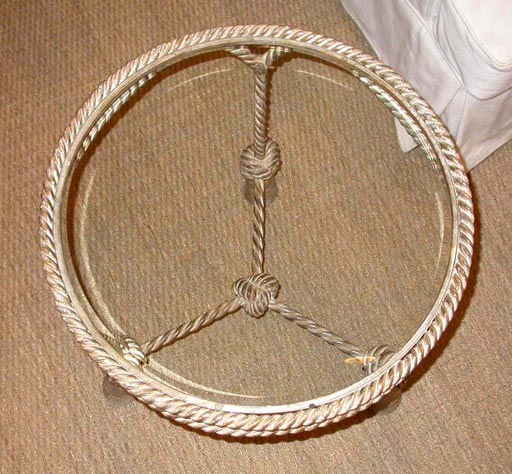 Painted iron rope side table with three knot and tassel feet. Glass top