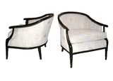 #1304  Pair of ebonized faux-bamboo lounge chairs