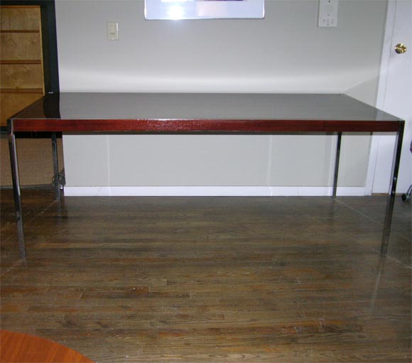 Beautiful rosewood table with steel legs and inset steel detail on the table top, designed by Richard Schultz