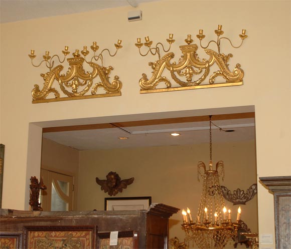 Pair of Italian giltwood over-door ornaments with appliques