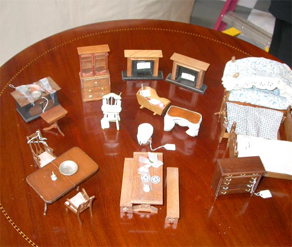 This one hundred plus pieces is a hoot.  It would delight any doll house owner.   It really has everything including the kitchen sink!  Lots of small pieces like a candlestick,  bedspreads, mini containers of food, chandelier mini pictures in