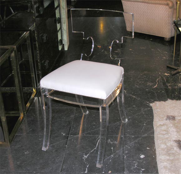 Klismos-style chair in Plexiglas, upholstered in muslin.