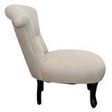 A Petite Slipper Chair with Ottoman