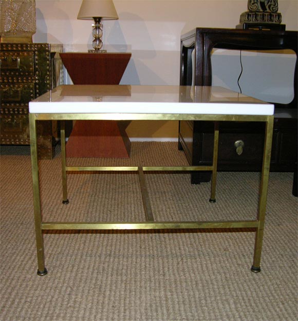 A pair of occasional tables with white Carrara Vitrolite glass tops on square brass tube frames, model. no. 8732, by Paul McCobb for Calvin Furniture. U.S.A., circa 1950.