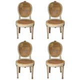 Four Louis XVI cane seat side chairs.
