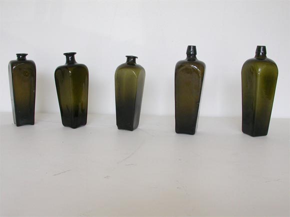 THE GIN BOTTLES VERY FROM 18THC TO 19THC SOME ARE HAND BLOWN AND OTHERS ARE SAND MOLDED  , THESE BOTTLES ARE FOUND MOSTLY IN NEW ENGLAND STATES/WE HAVE A COLLECTION OF 12 BOTTLES ALL VARIOUS SHAPES AND SIZES, SOME ARE HAND BLOWN AND OTHERS ARE MOLDED