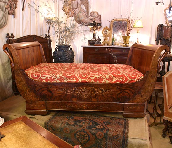 Figured walnut and marquetry sleigh bed.  Graceful form with swan heads.  Wall placement required since decoration on one side.   Interior:  47.5