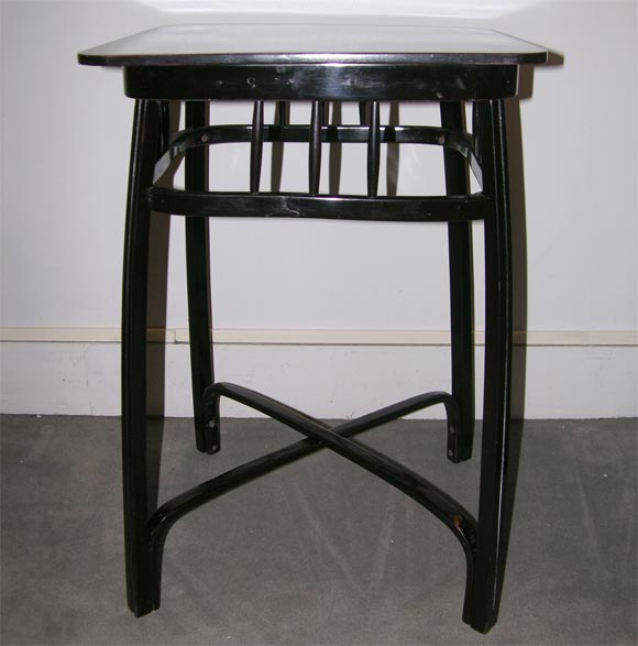 A pair of square ebonized sidetables