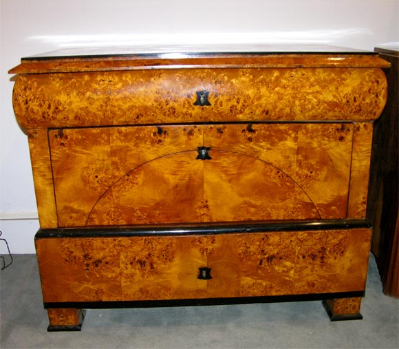 A fine Neo-Classical chest of drawers.<br />
Karelian Birch with ebonized details.