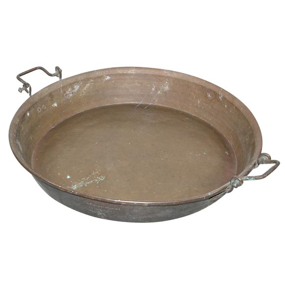 Huge round metal 1940s paella pan with two side handles.