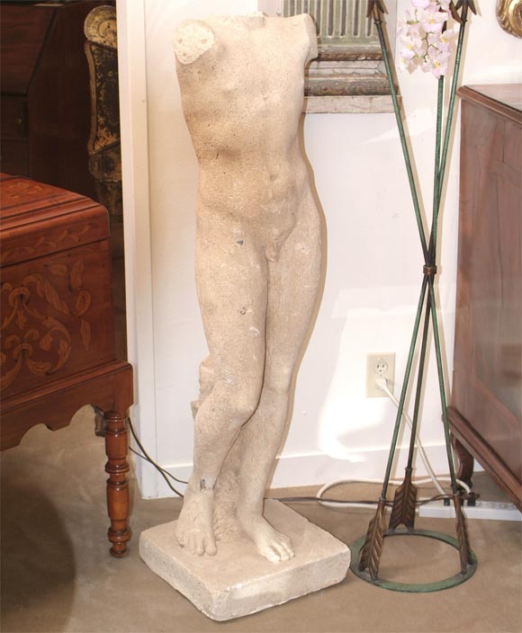 A movie prop from Los Angeles.  Cast stone in the style of an ancient Greek or Roman statue of a young man.