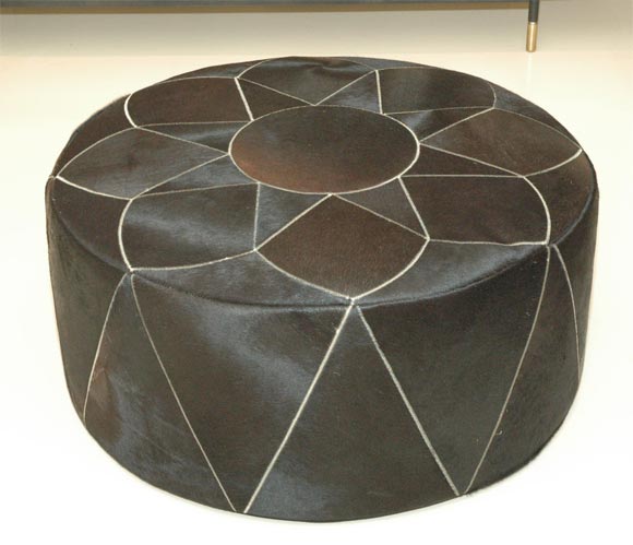 Gorgeous dark, dark chocolate cowhide pouf made by Grand Splendid with elaborate stitched star pattern.  Available in custom hide colors and also in one smaller 26' diam. size or 42