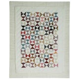 1920'S SMALL PIECED TRIANGLES DOLL QUILT MOUNTED