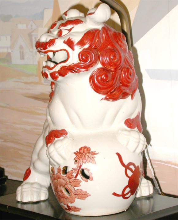 Mid-20th Century pair of porcelain foo dog lamps