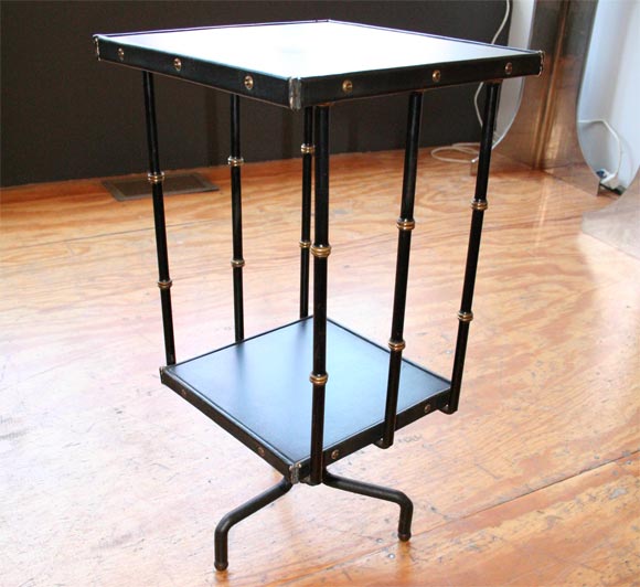 Revolving book stand, library table by Jacques Adnet