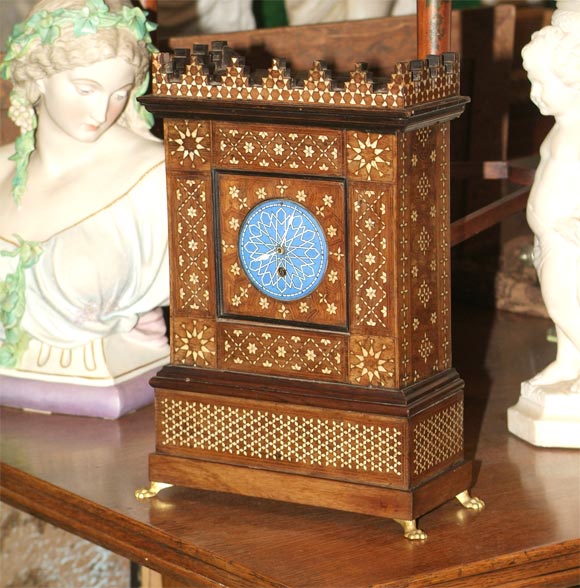 Blue and white enamel face. Syrian rosewood and bone inlay. French movement. Original pendulum and key.