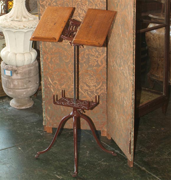 Cast Iron Dictionary stand with unusual nickel plated support column and adjustable oak book holder.