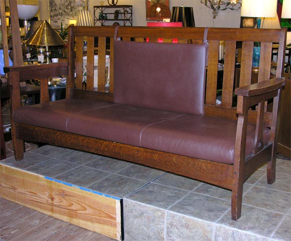 Fine mission oak settle by Charles Limbert, Limbert Furniture Co., Holland, Michigan.  Fine and original condition, cut-outs.***Contact Information: AOL (American Online) users may experience difficulties sending emails to us or receiving emails