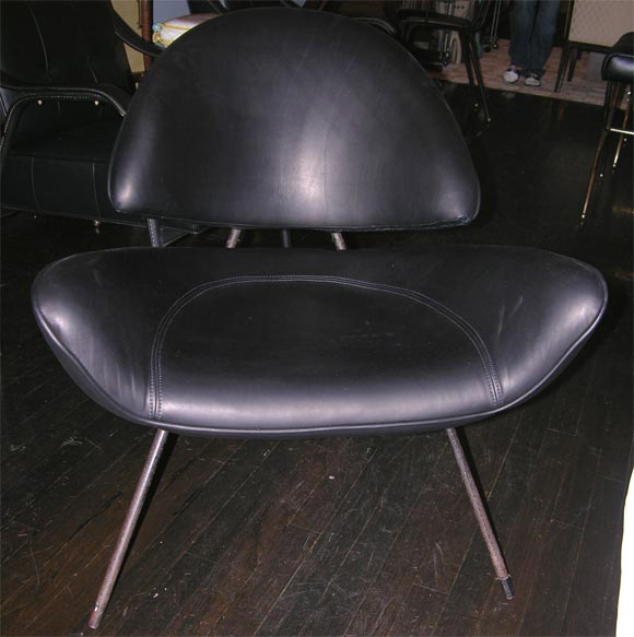 fantastic pair of chairs by Jean Royere, leather over a steel construction. see De Beyrie's book for the matching sofa