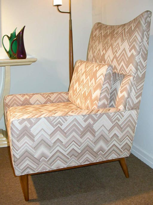 High back club chair designed by Paul McCobb