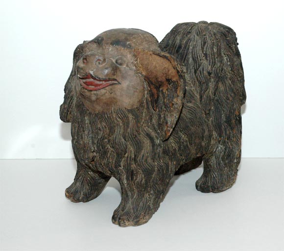 Pekingese were regarded as manifestation of the legendary Foo Dog that drove away spirits.  They were venerated as semi-divine by the Chinese.  Commoners had to bow to them,you were punished by death if you stole one, and when an emperor died his