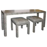 Snake skin parsons table and ottomans.