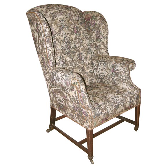 English Wing Chair in Antique Fabric For Sale