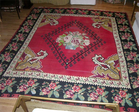 Turkish Kilim red, black & beige area rug with floral border and center medallion.  Recently cleaned and fully restored.  Includes 1/8
