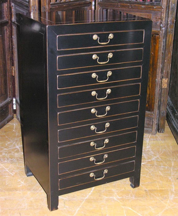 Elegant black Korean scroll chest, with simple lines and wide narrow drawers.
