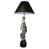 sculptural metal lamp with bright bronzed finish