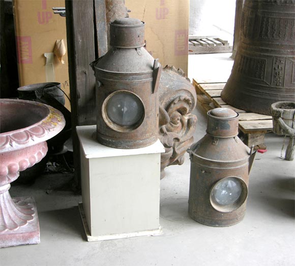 A pair of English Railroad lamps/lanterns, c1920-1935. Could be converted into hanging lanterns or table lamps. Each top opens for interior access and each bottom has a 1