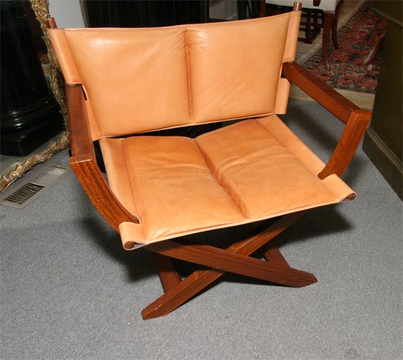 Leather and mahogany fold up chair signed west Nova Furniture Norway.