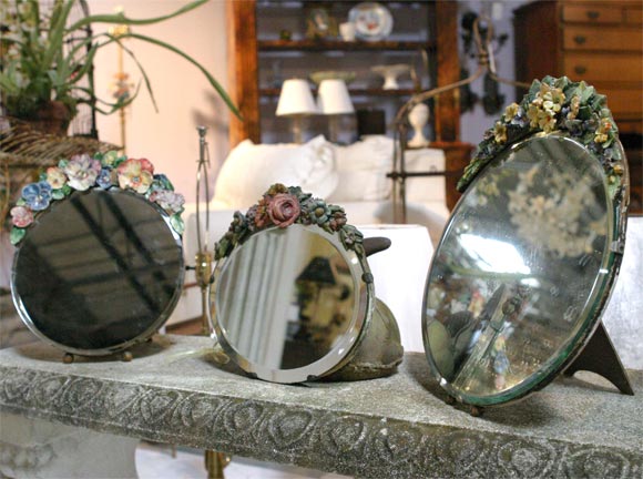 This is a delightful collection of three Barbolla mirrors.  They are in very good shape.  The price is lower than any English market.  There are slight chips as shown in the photo.  Each mirror has a different collection of flowers.  They can be