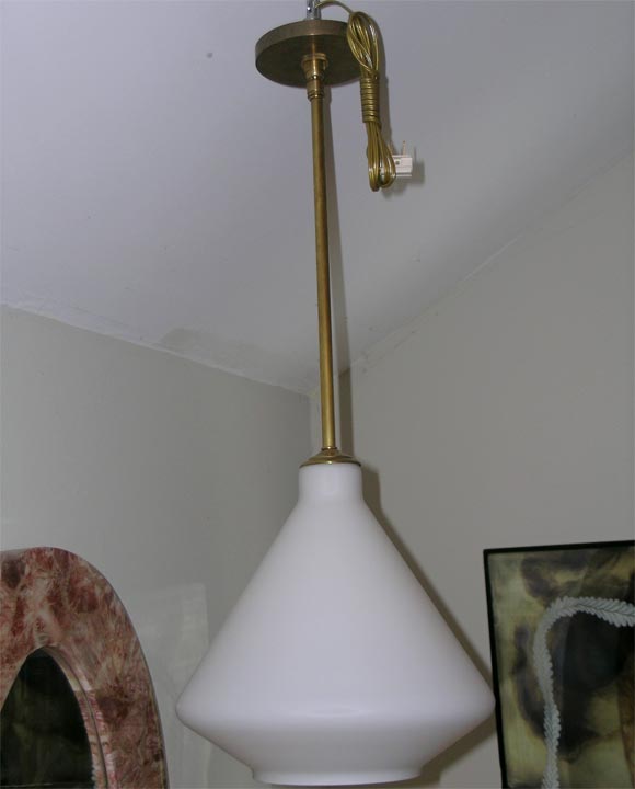 White opaque glass pendant with brass detail. Single bulb - various shapes available.