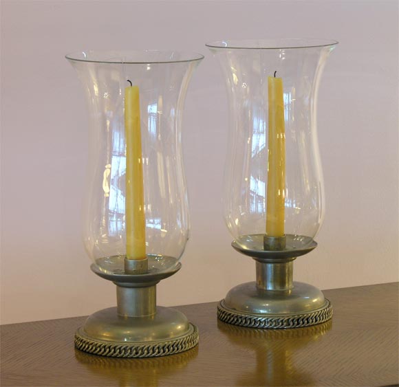 Hurricane candle holders in silverplate and Baccarat crystal. Both bases and glass are signed.