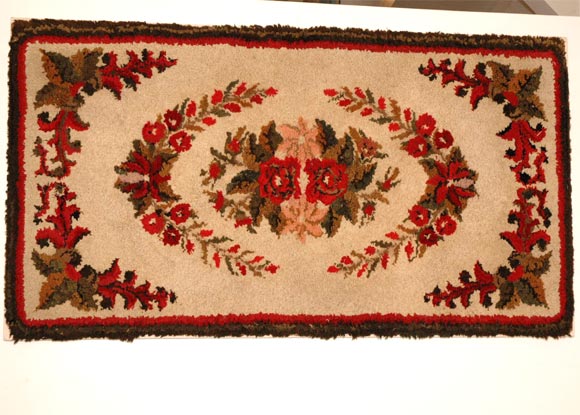 Great colors and design mounted hand hooked floral New England rug very rich in colors and pristine condition, mounted on 19th century linen and wood frame stretcher.