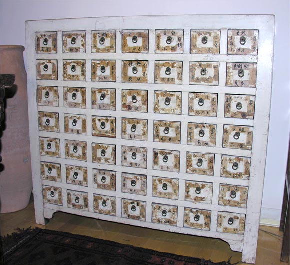 White painted apothecary chest with Chinese pharmacopedia labels