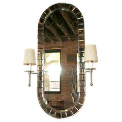 Vintage Tommi Parzinger style wall mirror with attached sconces