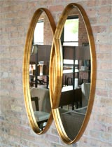 Gilt wood double oval mirror