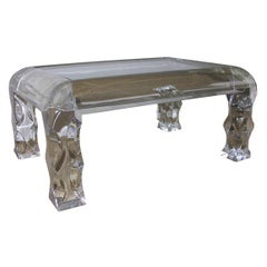 A Lucite 
Glass Rounded Rectangular Occasional Table.