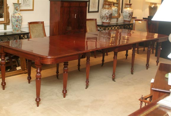 A good wide and long William IV period mahogany dining table, circa 1835. This table breaks into three separate tables with two additional later matching leaves. Table this width are exceedingly rare as they are so often remounted onto pedestals.