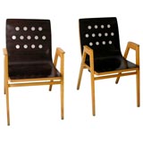 stacking armchairs by roland rainer