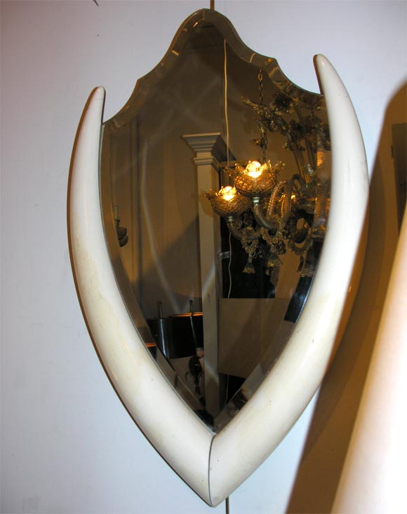 An ivory frame mirror