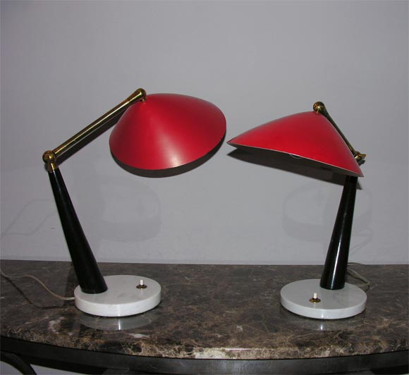 An Italian 1950s articulated table lamps, signed Stilux.