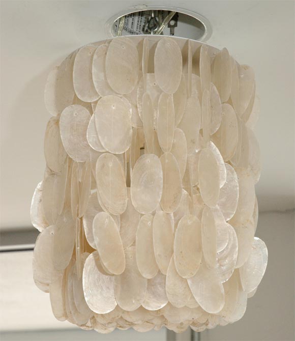 This capiz shell light can be custom ordered to specific dimensions.  Oval shells are no longer available (as shown in photos), however this fixture can be made with round capiz shells.  You can choose from powder coated or nickel plated hardware. 