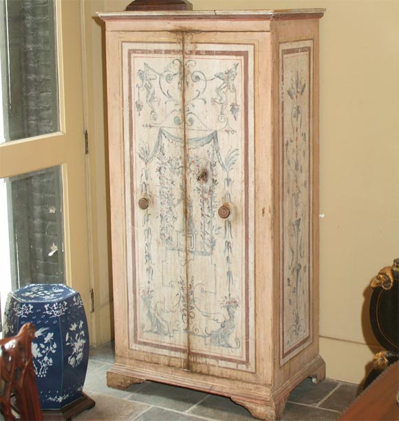 An Italian two-door painted cupboard