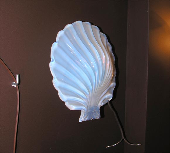 Opaline glass shell attached to brass hardware. Has 1 light