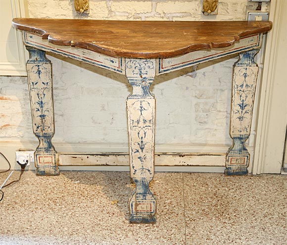 An early 20th century console table painted in the Portuguese style with natural wood top.