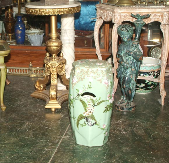 Celedon glazed porcelain garden stool with a traditional multi-colored enameled decoration under glaze.